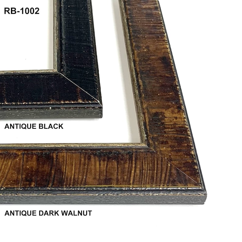 May include: Two picture frames, one in antique black and one in antique dark walnut. The frames are both wood with a distressed finish. The frames are both RB-1002.