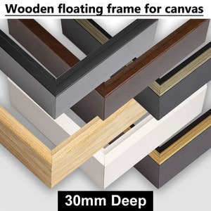 May include: A close-up of six different wooden floating frames for canvas, each with a 30mm depth. The frames are in various colours, including natural wood, white, grey, brown, and gold.