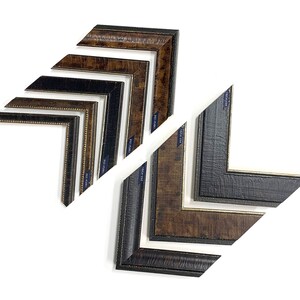 May include: Assortment of picture frames in various sizes and styles, including black, brown, and gold finishes. The frames are arranged in a staggered pattern, showcasing their different designs.