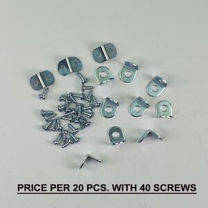 May include: A set of 20 silver metal shelf brackets with 40 screws. The brackets are L-shaped and have a hole in the centre. The screws are silver and have a Phillips head. "PRICE PER 20 PCS. WITH 40 SCREWS" is printed on the white background.