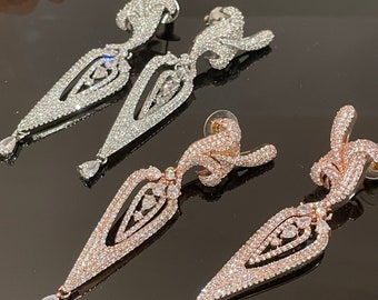 Pendientes con circonitas cúbicas: oro rosa, plata y joyas de boda.
