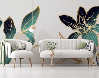 May include: A living room interior design with a white sofa and armchair, a small table with a potted plant, and a wall mural featuring a large floral design with teal and gold leaves.
