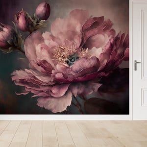 May include: A close-up of a large, pink peony flower against a dark background. The flower has many petals and is in full bloom. The petals are a deep pink colour and have a soft, velvety texture.