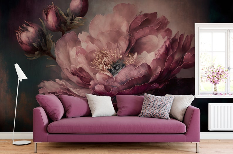 May include: A close-up of a large, pink peony flower against a dark background. The flower is in focus, and the background is blurred. The flower has many petals, and the centre of the flower is visible.