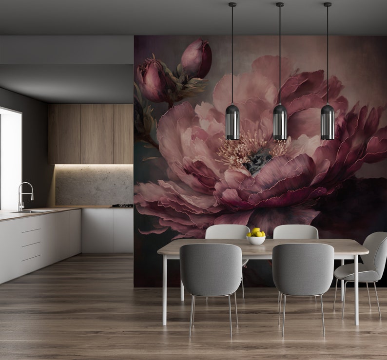 May include: A dining room with a floral wallpaper featuring a large pink peony. The wallpaper is behind a wooden table with four chairs. The table is set with a bowl of lemons.