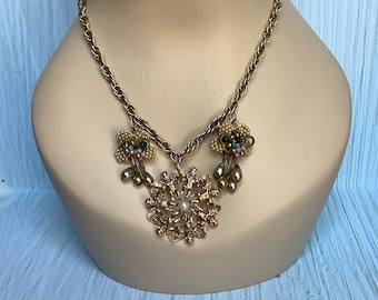Vintage gold toned chain with cherub brooch centerpiece and beaded earring accents assemblage necklace