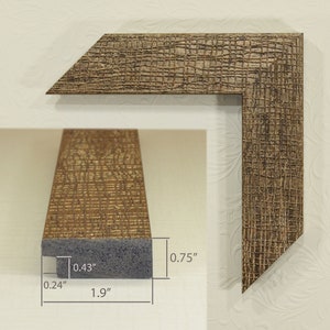 May include: A brown wood picture frame with a textured surface. The frame is 1.9 inches wide, 0.75 inches tall, and 0.43 inches deep.