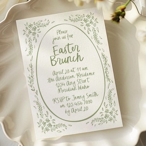May include: A white invitation card with a green floral border. The text reads "Please join us for Easter Brunch, April 28 at 11 am, the Anderson Residence, 1254 Any Street, Meridian Idaho, RSVP to Jenny Smith on 123 456 7890 by April 20."