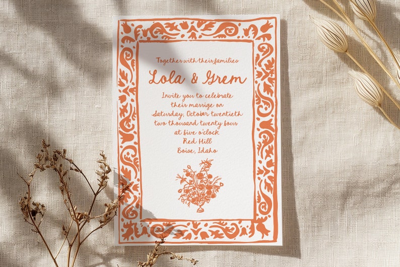 May include: A wedding invitation with an orange floral border. The invitation reads "Together with their families Lola & Grem Invite you to celebrate their marriage on Saturday, October twentieth two thousand twenty four at five o'clock Red Hill Boise, Idaho"