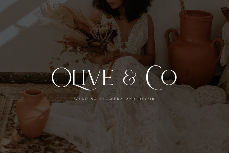 May include: A bride wearing a white lace dress holds a bouquet of dried flowers. The text "Olive & Co. Wedding Flowers and Decor" is displayed below the image.