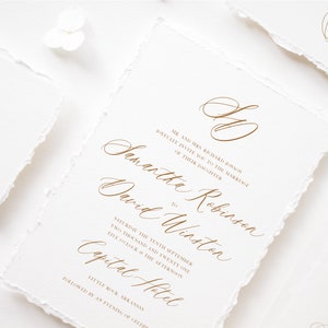May include: Wedding invitation with a white background and gold calligraphy text. The invitation reads "Mr. and Mrs. Richard Binson joyfully invite you to the marriage of their daughter Samantha Robinson to David Winston Saturday the tenth of September two thousand and twenty one five o'clock in the afternoon Capital Hotel Little Rock, Arkansas followed by an evening of celebrati"