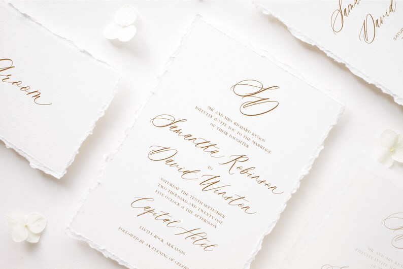 May include: Wedding invitation with a white background and gold calligraphy text. The invitation reads "Mr. and Mrs. Richard Binson joyfully invite you to the marriage of their daughter Samantha Robinson to David Winston Saturday the tenth of September two thousand and twenty one five o'clock in the afternoon Capital Hotel Little Rock, Arkansas followed by an evening of celebrati"