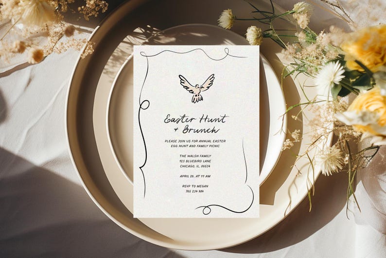 May include: A white card with black calligraphy outlining a dove with a pink body. The text reads "Easter Hunt + Brunch" and includes details for an annual Easter egg hunt and family picnic. The card is on a beige plate with a white background.