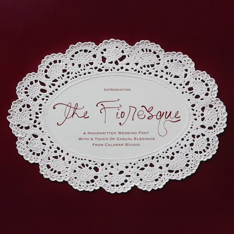May include: A white, oval-shaped doily with a delicate lace pattern surrounds a central panel. The panel features the text "The Fioresque" in a handwritten font, advertising a wedding font with casual elegance from Calamar Studio.