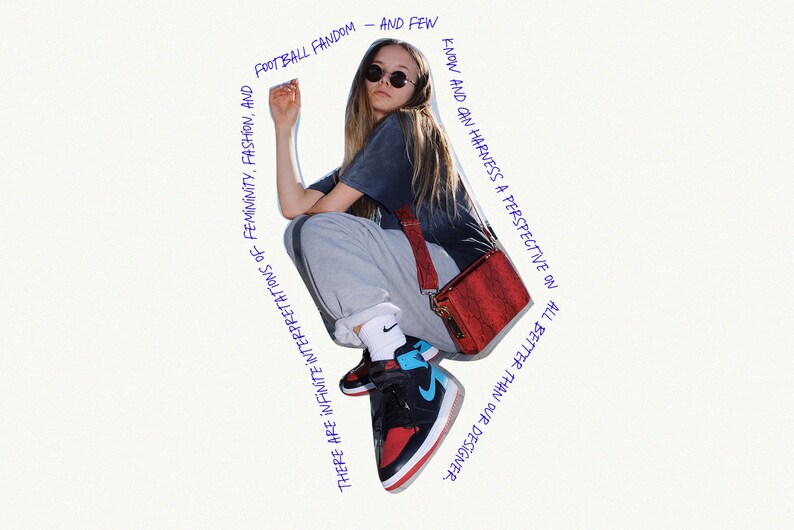 May include: A woman wearing a gray sweatshirt, black t-shirt, and black and red sneakers with a blue accent. She is carrying a red crossbody bag with a black strap. The image has text that reads "FOOTBALL FANDOM - AND FEW KNOW AND CAN HARNESS A PERSPECTIVE ON ALL BETTER THAN OUR DESIGNER. THERE ARE INFINITE INTERPRETATIONS OF FEMININITY, FASHION, AND"