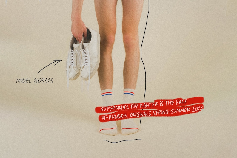 May include: A person wearing white socks with red and blue stripes is holding a pair of white sneakers. The text "SUPERMODEL ROY KANTER IS THE FACE OF RUNDEEL ORIGINALS SPRING-SUMMER 2024" is written in red on a white background.