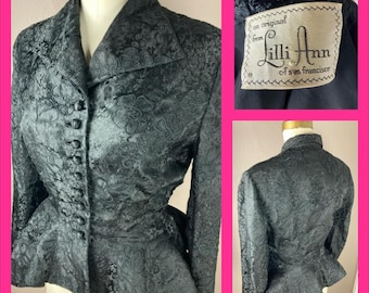May include: A black, embroidered, vintage jacket with a peplum hem and a button-up front. The jacket has a label that reads "an original from Lilli Ann of San Francisco".