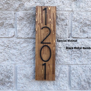 May include: A wooden sign with the numbers 1201 in black metal lettering. The sign is made of special walnut wood.