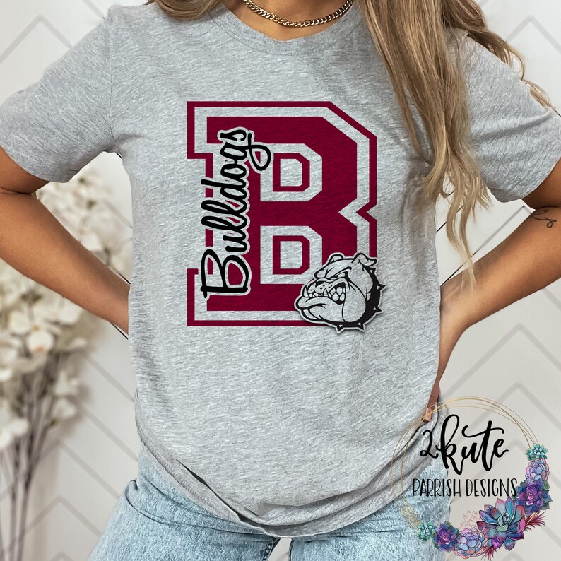 May include: A gray t-shirt with a maroon "B" and the word "Bulldogs" printed on the front. The "B" has a white bulldog head inside.