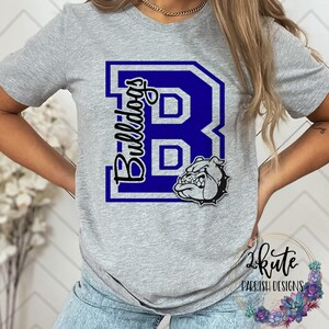 May include: Gray t-shirt with a blue and white letter "B" and the word "Bulldogs" in black. A bulldog head is inside the letter.
