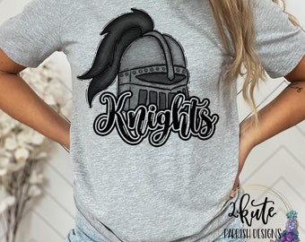 May include: Gray t-shirt with a black and white illustration of a knight's helmet and the word "Knights" in a stylized font.