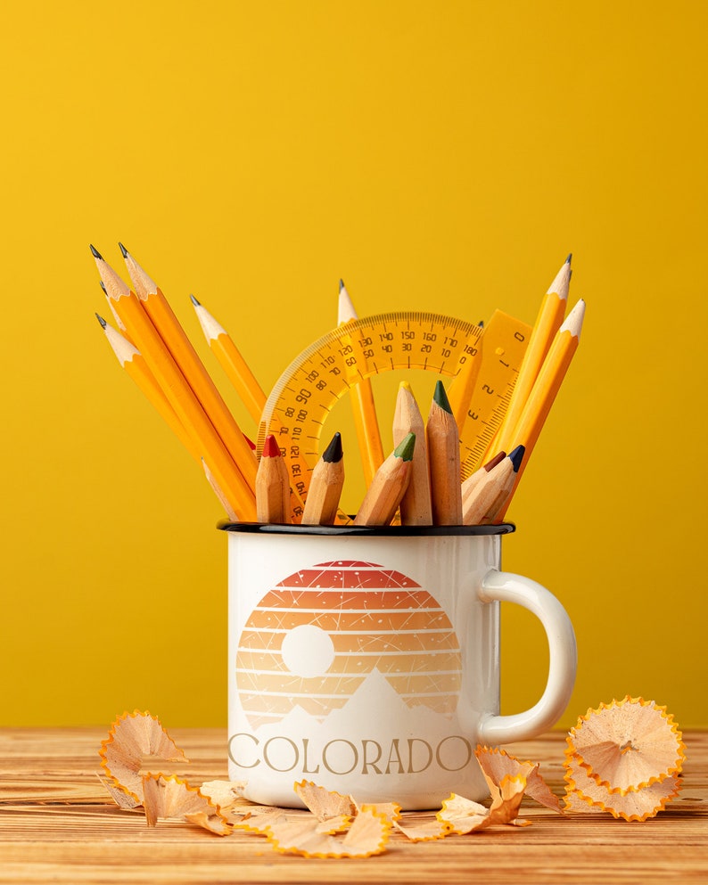 Born to be in the Great Outdoors, this custom Retro Colorado Sunset enameled camp mug is an outdoor lovers best sidekick. With 12oz for your favorite beverage, these camping mugs are made of metal, making them a hard-wearing choice for any adventure.