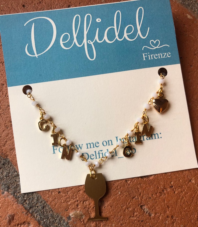 Rosary-type necklace with pendants and CIN CIN writing