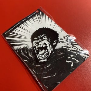 Puede incluir: Ilustración en blanco y negro de una cara gritando con dientes afilados. La imagen está sobre un fondo blanco con líneas negras que irradian hacia afuera. El texto "INSTAGRAM.COM/BONGOOISHIRTS" está en la parte superior de la imagen.