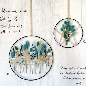 May include: Two decorative wall hangings with dried flowers and greenery. One is 11.8 inches in diameter, the other is 7.9 inches. The flowers are teal, beige, and cream-colored, arranged within black metal rings. The text on the image says "Deko Ideen aus dem Set Gr.S".