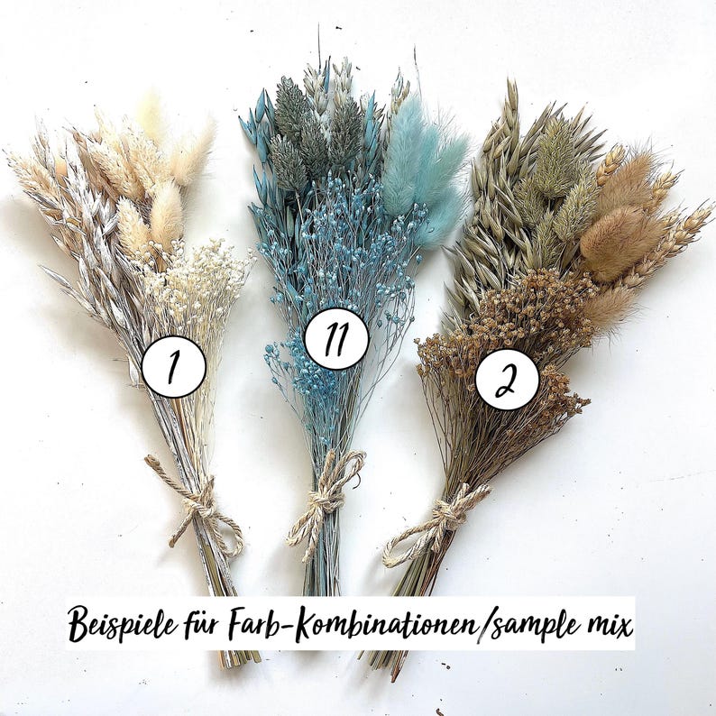 May include: Three bouquets of dried flowers, each tied with twine. The bouquets feature a variety of textures and colors, including beige, blue, and brown. The text at the bottom reads "Beispiele f&uuml;r Farb-Kombinationen/sample mix."