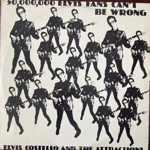 May include: Black and white album cover with the text "50,000,000 Elvis Fans Can't Be Wrong" and "Elvis Costello and the Attractions". The cover features a repeated image of a man playing a guitar.