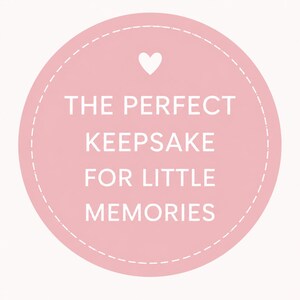 May include: A light pink circular graphic with a white dashed border and a white heart at the top. The text reads "THE PERFECT KEEPSAKE FOR LITTLE MEMORIES" in white, sans-serif font.
