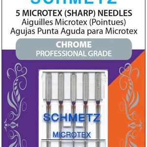 Puede incluir: Un paquete de 5 agujas de máquina de coser Microtex cromadas. El paquete está etiquetado con "SCHMETZ" y "CHROME PROFESSIONAL GRADE". Las agujas son de tamaño 130/705 H-M y 80/12.