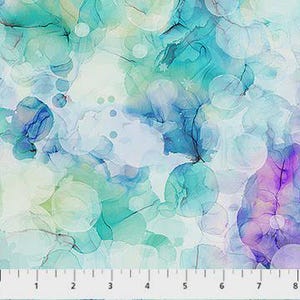 May include: Abstract fabric with a watercolour effect in shades of teal, blue, and purple. The design features overlapping circular shapes and flowing lines, creating a soft, ethereal pattern. The fabric has a light, airy feel, suitable for various craft projects.