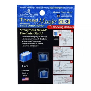 May include: Package of two blue Thread Magic Cube thread conditioner for sewing machines. The package shows a sewing machine and instructions for using the product. The text on the package reads "Thread Magic Cube, The Ultimate Thread Conditioner, Strengthens Thread! Eliminates Static!" and "2 PCS, Acid-Free, Made in USA".