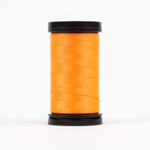 May include: A spool of bright orange thread wound on a black plastic bobbin.