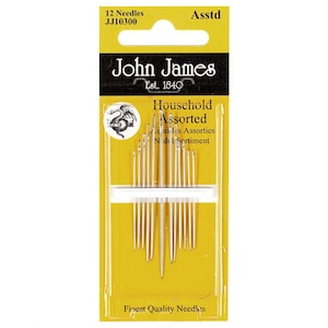 May include: A package of 12 assorted John James household needles. The needles are silver and arranged in a clear plastic holder, set against a yellow and black background. The packaging includes the text "Finest Quality Needles."