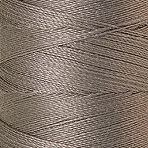 May include: A spool of light brown thread.