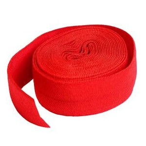 May include: A roll of bright red elastic band, ideal for sewing projects or crafts.