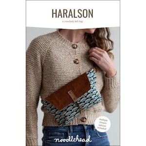 May include: A crossbody belt bag with a brown leather flap and a patterned fabric body in shades of teal and white. The bag is labeled "HARALSON" and "noodlehead". The bag has multiple closure options.