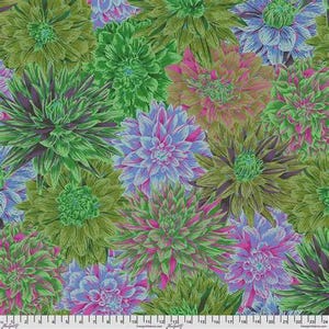 May include: A fabric print featuring a dense pattern of dahlia flowers in shades of lime green, magenta, purple, and light blue. A white ruler with black markings is visible at the bottom edge, showing measurements in inches and centimetres.