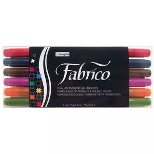 May include: A pack of six dual-tip pigment ink markers in a variety of colors, including red, blue, brown, pink, orange, and green. The markers are labeled "Fabrico" and are designed for use on fabric.