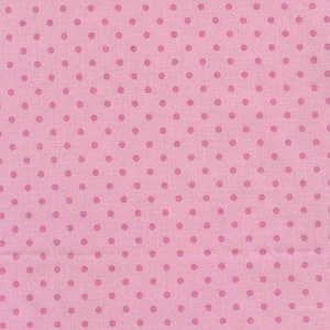 Może przedstawiać: Różowy materiał z białym wzorem w kropki.