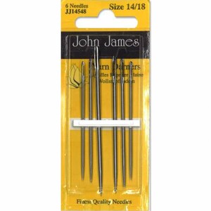 May include: A package of six John James yarn darners needles, size 14/18. The needles are silver-colored and arranged in a row on a white holder, set against a yellow and black background. The package includes the text "Finest Quality Needles."