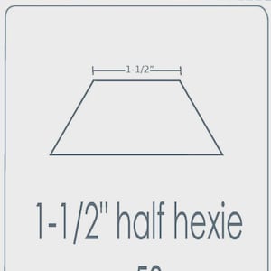 May include: A light gray template for English Paper Piecing. The template is a half hexie shape, 1-1/2 inches wide, with the text "1-1/2" half hexie x 50". The top of the template reads "EPP iron ons" and "English Paper Piecing templates".