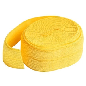 May include: A roll of bright yellow elastic band, perfect for sewing projects or crafts.