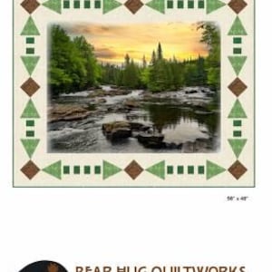 May include: A rectangular quilt with a landscape scene of a river and forest at sunset. The quilt is 56" x 48" and features a border with green triangles and brown diamonds. The text "ROCK HOP" is at the top.