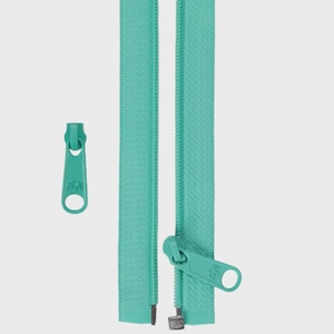 May include: A teal-coloured zipper and pull tab are displayed against a plain background. The zipper tape is a solid teal, and the pull tab has a circular hole. The zipper is shown both closed and open.