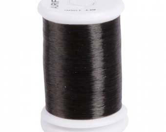 May include: A spool of black thread labeled "100% RAY.  COTTON MADE IN ITALY" and "ARTFIL".
