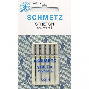 May include: A pack of five silver sewing needles labelled "SCHMETZ STRETCH 130/705 H-S 190/14".
